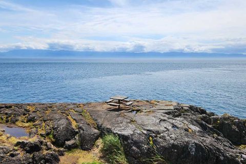 Rocky shoreline and ocean at Otter Point Community Park near Sooke, BC
