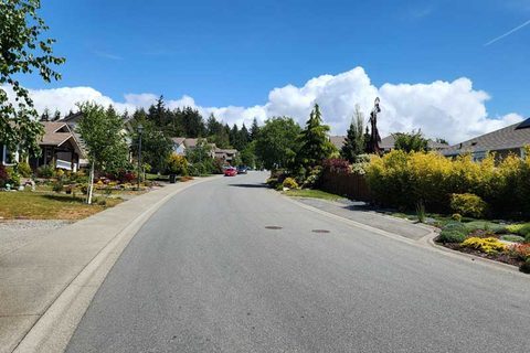 Residential street with detached homes in a Sooke neighbourhood